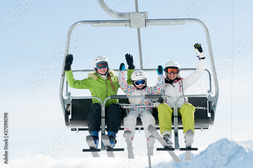 Photo: Skiers on ski lift Skiers on ski lift