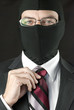 Businessman In Balaclava Straightens Tie
