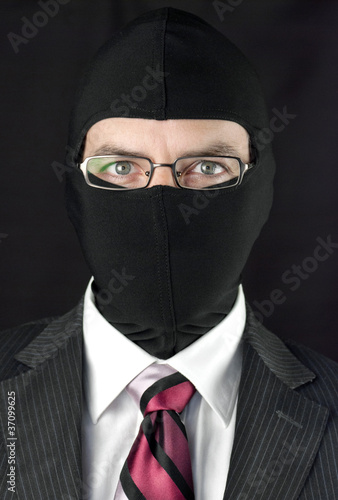 Photo: Businessman In Balaclava Looks At Camera Businessman In Balaclava Looks At Camera