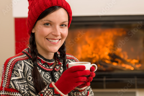 Photo: Fireplace winter christmas woman drink home Fireplace winter christmas woman drink home