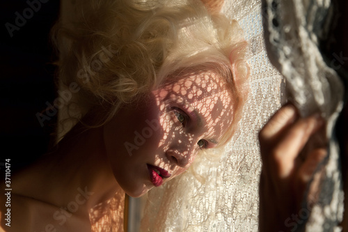 Photo: Girl watching through the window Girl watching through the window