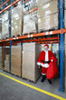 Professional Santa Claus for hire waiting in storehouse