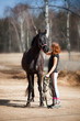 Portrait of smiling young woman with horse