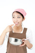 attractive asian woman cooking
