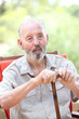 Foto: senior man with walking stick senior man with walking stick