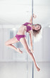 Young pole dance woman