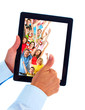 Tablet computer and group of happy people.