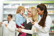 Photo: Pharmacy chemist, mother and child in drugstore Pharmacy chemist, mother and child in drugstore