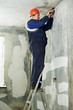 Electrician at cable wiring work