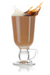 Cup of coffee. Milk and black coffee splashing