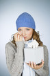 A young woman crying,  wiping her tears away with a tissue