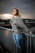 sexy girl posing on bridge at sunrise