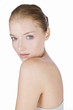 Portrait of a young woman with blue eyes, hair in a bun