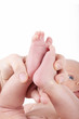 mother showing feet of newborn baby girl