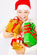 Happy Santa girl holding gifts
