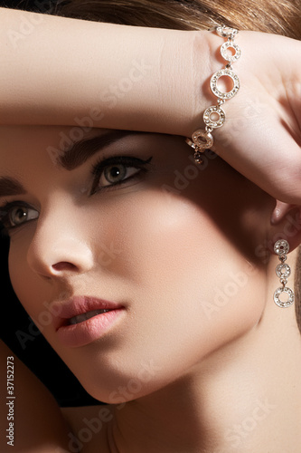 Photo: Accessories, jewelry gold bracelet, earrings with diamonds Accessories, jewelry gold bracelet, earrings with diamonds