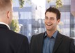Laughing coworkers outside of office
