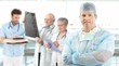 Mid-adult surgeon with medical team in background