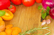 wooden desk as frame of colorful vegetables