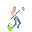 young blonde attractive woman with tools for housecleaning