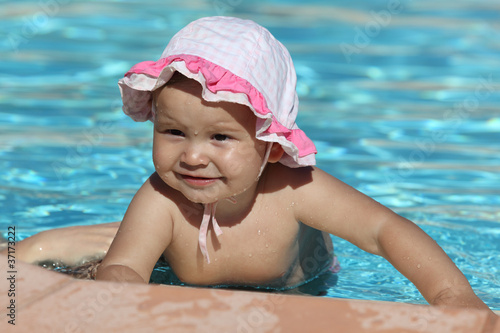 Photo: Cute toddler girl at the swimming pool Cute toddler girl at the swimming pool