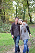 Photo : Couple taking an autumnal stroll Couple taking an autumnal stroll