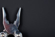 Close up pliers black background