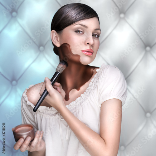 Photo: Portrait of attractive young adult woman applying bronzing cream Portrait of attractive young adult woman applying bronzing cream