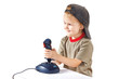 Little boy plays with a joystick on a white background