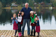 Photo: Happy Old Man with a group of grandchildren Happy Old Man with a group of grandchildren