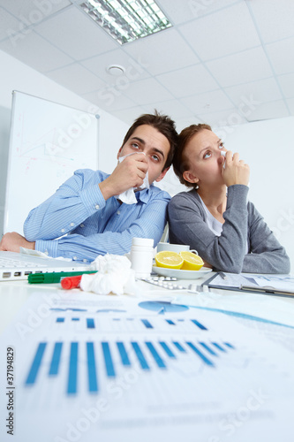 Photo: Ill office workers Ill office workers