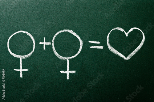 Photo: Homosexual copule in love symbols on green blackboard Homosexual copule in love symbols on green blackboard