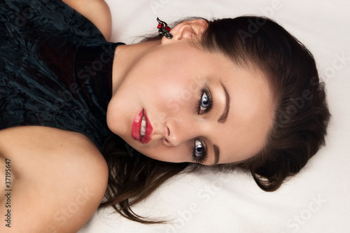 Photo: Sexual pretty brunette lying on the floor Sexual pretty brunette lying on the floor