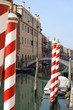 Red and white striped gondola poles (Venice Italy) Red and white striped gondola poles (Venice Italy)
