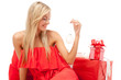 Foto: Young blonde woman sitting with Christmas presents Young blonde woman sitting with Christmas presents