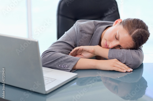 Photo: Young businesswoman sleeping Young businesswoman sleeping