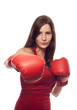 Confident young woman with boxing gloves
