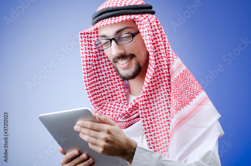 Photo: Young arab with tablet computer Young arab with tablet computer