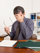 Foto: Worried Business Man Rubbing Tired Eyes Worried Business Man Rubbing Tired Eyes