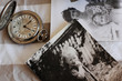 Photo: antique pocket watches and old photos. Focus on the clock antique pocket watches and old photos. Focus on the clock