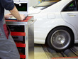 Car with test bench technology in a garage