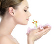 Profile face of beautiful girl smelling flower Profile face of beautiful girl smelling flower