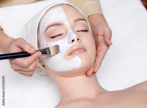 Photo: Woman having a facial cosmetic mask Woman having a facial cosmetic mask