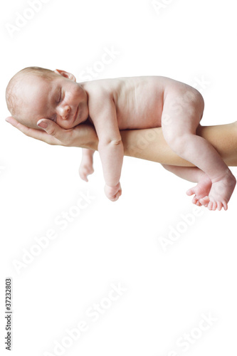 Photo: Newborn child on white, isolated. Newborn child on white, isolated.