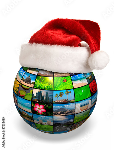 Photo: Christmas concept - photo globe in Santa hat Christmas concept - photo globe in Santa hat