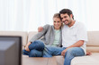 Foto: Happy couple watching TV Happy couple watching TV