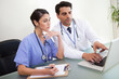 Young doctors working with a notebook