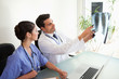 Doctors looking at a set of X-ray