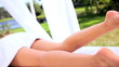 Female Client Relaxing with Foot Massage at Health Spa