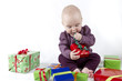 young child unpacking presents